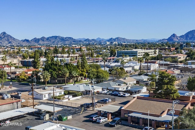 birds eye view of property with a mountain view