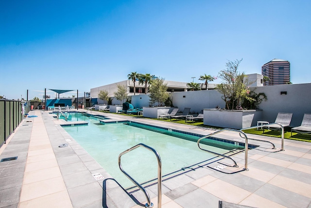 view of swimming pool with a patio