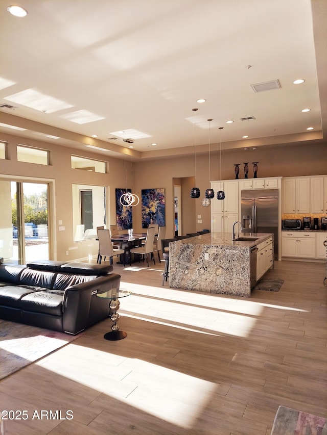 interior space featuring sink and light hardwood / wood-style floors