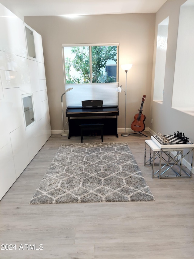 sitting room with hardwood / wood-style floors