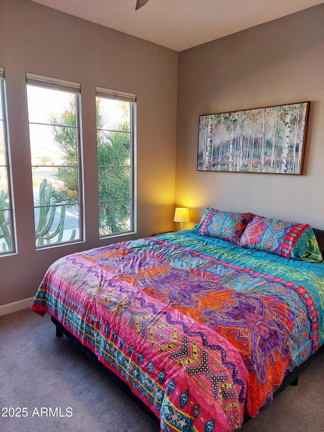 bedroom featuring ceiling fan and carpet floors