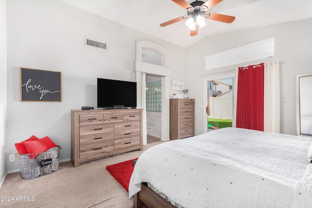 bedroom with connected bathroom, light carpet, ceiling fan, and vaulted ceiling