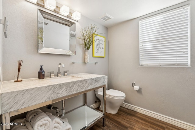 4563 E Libby St, Phoenix, AZ 85032 - bathroom featuring a sink and wood finished floors