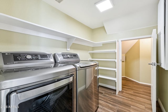4563 E Libby St, Phoenix, AZ 85032 - laundry area featuring washing machine and clothes dryer and wood finished floors