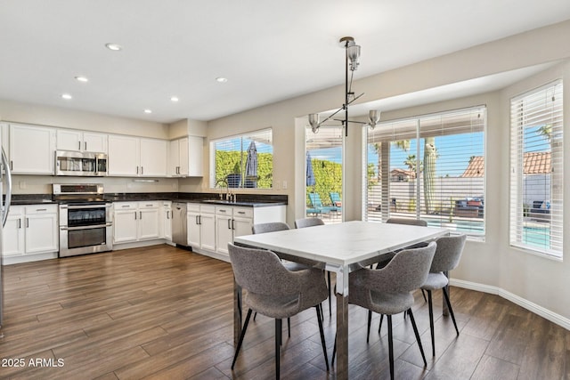 4563 E Libby St, Phoenix, AZ 85032 - dining room featuring recessed lighting, dark wood finished floors, and a chandelier
