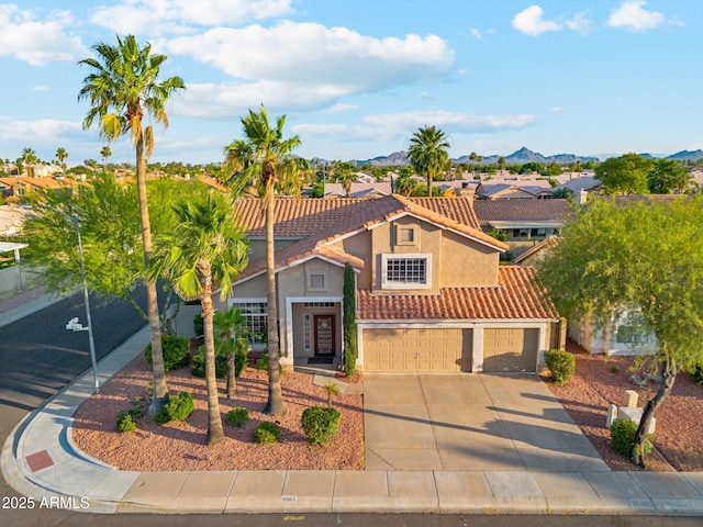 4563 E Libby St, Phoenix, AZ 85032 - mediterranean / spanish house featuring stucco siding, a residential view, a tile roof, an attached garage, and driveway