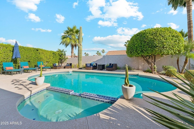 4563 E Libby St, Phoenix, AZ 85032 - view of swimming pool featuring an outdoor hangout area, a pool with connected hot tub, a patio area, and a fenced backyard