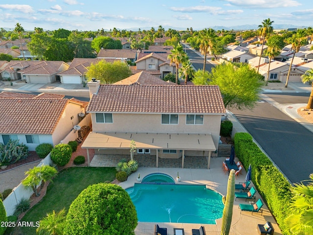4563 E Libby St, Phoenix, AZ 85032 - view of swimming pool featuring a residential view, a pool with connected hot tub, a fenced backyard, and a patio