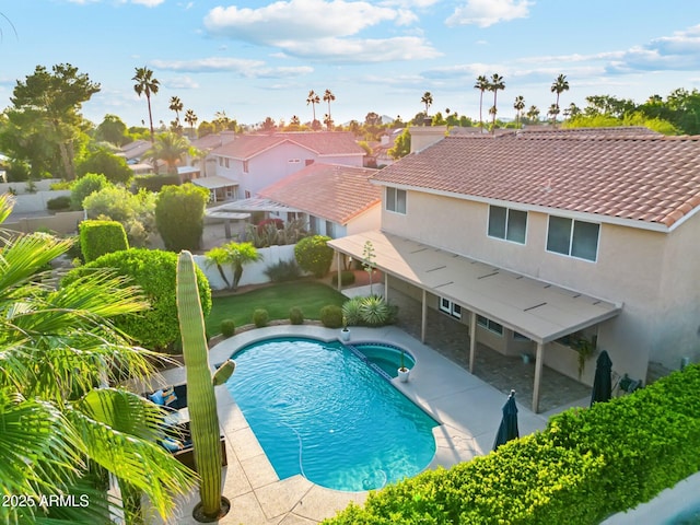 4563 E Libby St, Phoenix, AZ 85032 - view of swimming pool with a pool with connected hot tub, a fenced backyard, a patio, and a residential view
