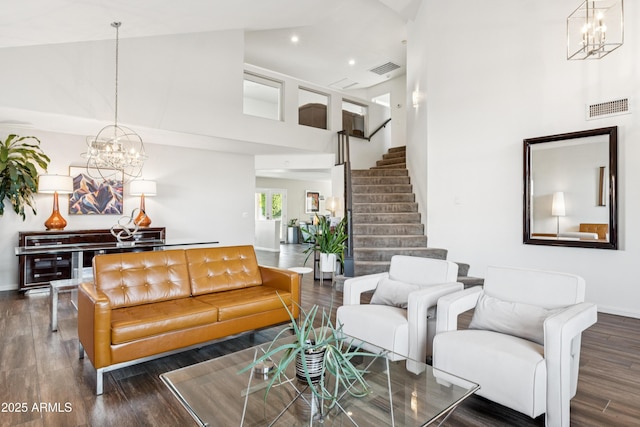 4563 E Libby St, Phoenix, AZ 85032 - living room featuring a chandelier, a high ceiling, wood finished floors, stairs, and recessed lighting