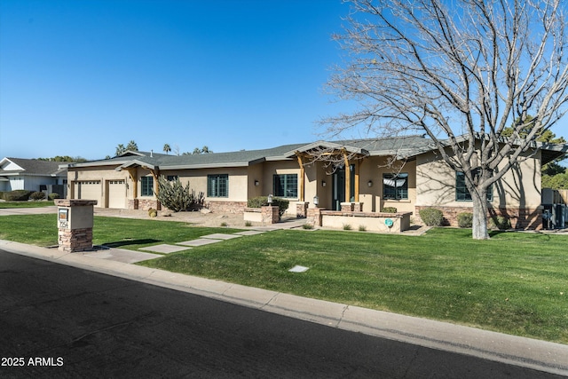 view of front of home with a garage and a front lawn