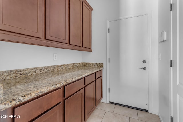 interior space with light tile patterned floors