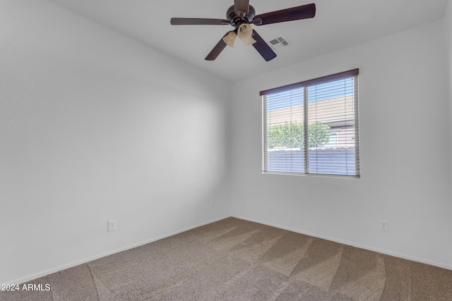 unfurnished room with ceiling fan and carpet floors