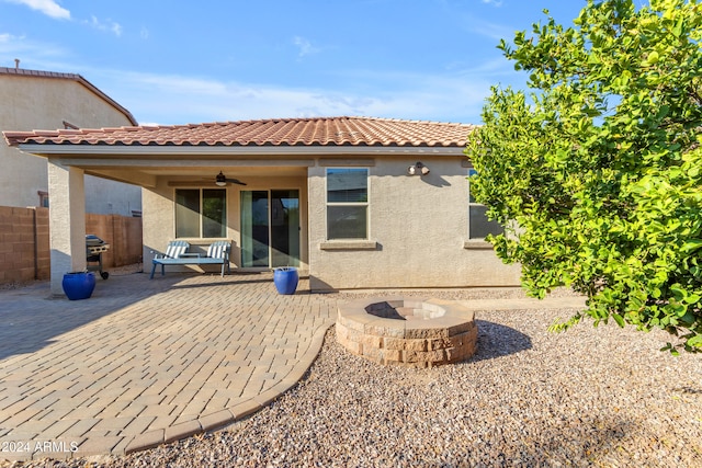 back of house with a patio, an outdoor fire pit, and ceiling fan