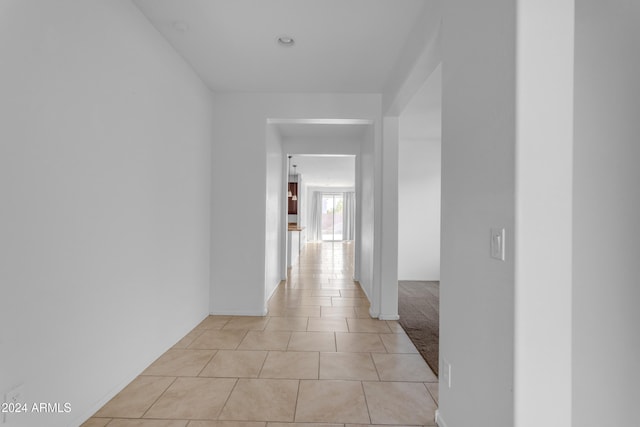 hall with light tile patterned flooring