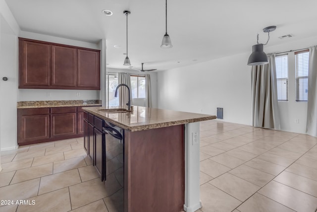 kitchen with ceiling fan, sink, an island with sink, decorative light fixtures, and light tile patterned floors