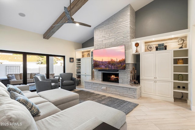 living area with a stone fireplace, beamed ceiling, high vaulted ceiling, and a ceiling fan