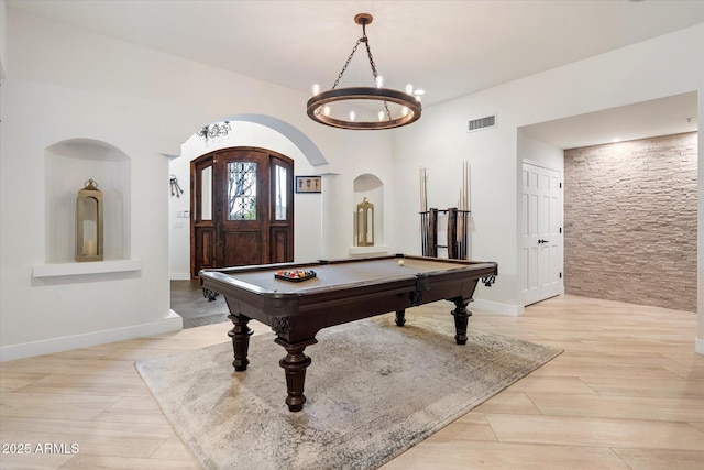 recreation room with visible vents, pool table, baseboards, arched walkways, and a notable chandelier