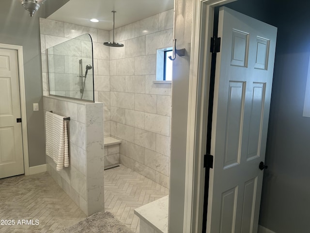 full bath with a walk in shower and baseboards