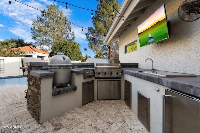 view of patio / terrace with a grill and an outdoor kitchen