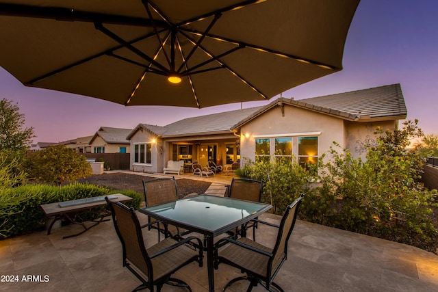 view of patio / terrace featuring outdoor dining area and fence