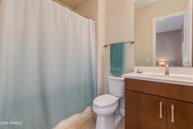 bathroom with tile patterned flooring, a shower with curtain, vanity, and toilet