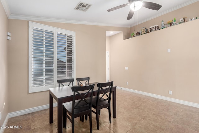 dining space featuring ceiling fan, ornamental molding, and light tile patterned floors