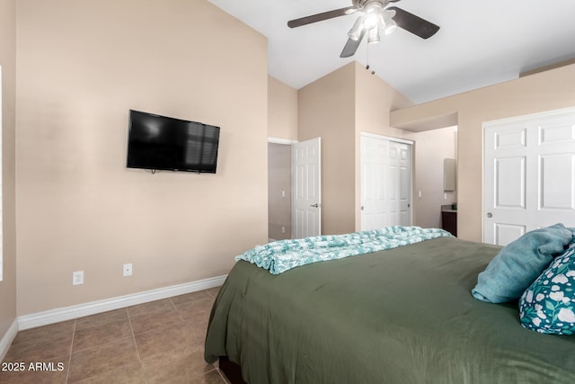 tiled bedroom featuring lofted ceiling and ceiling fan