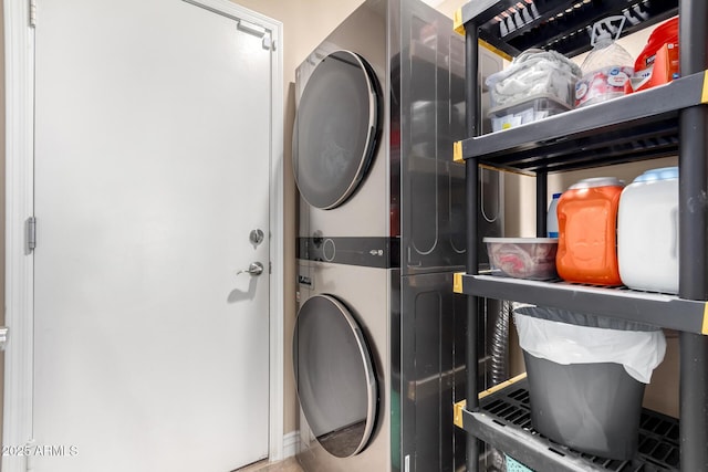 clothes washing area with stacked washer / drying machine