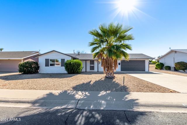 ranch-style home with a garage