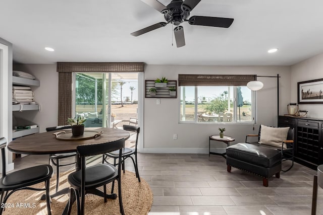 dining room with a wealth of natural light and ceiling fan