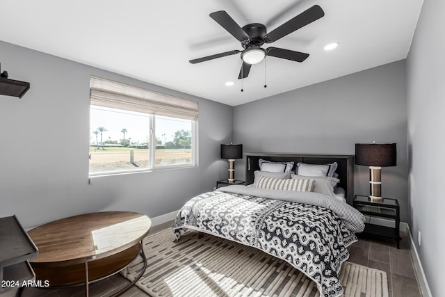 bedroom featuring ceiling fan and dark wood-type flooring