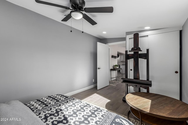 bedroom featuring ceiling fan and hardwood / wood-style flooring