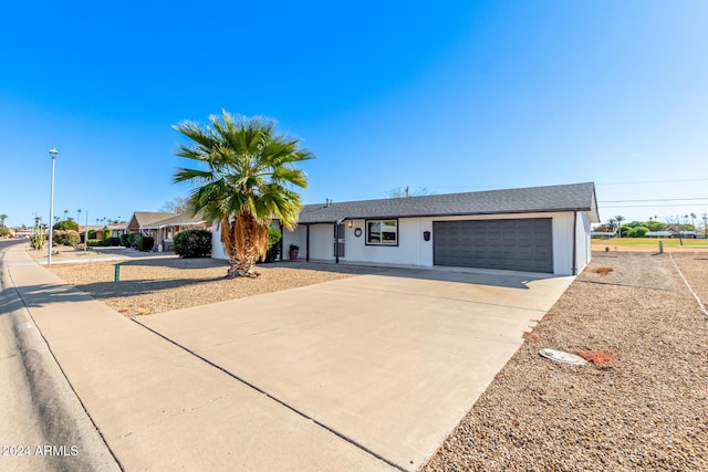 ranch-style home featuring a garage