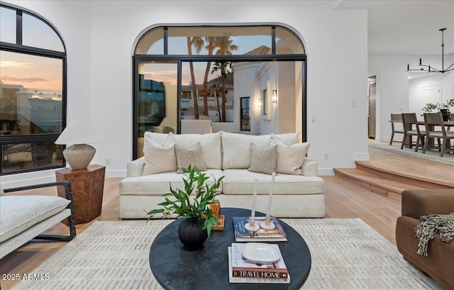 living area with wood finished floors and baseboards