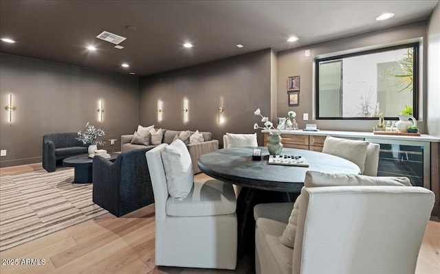 dining area featuring light wood-style flooring, visible vents, and recessed lighting