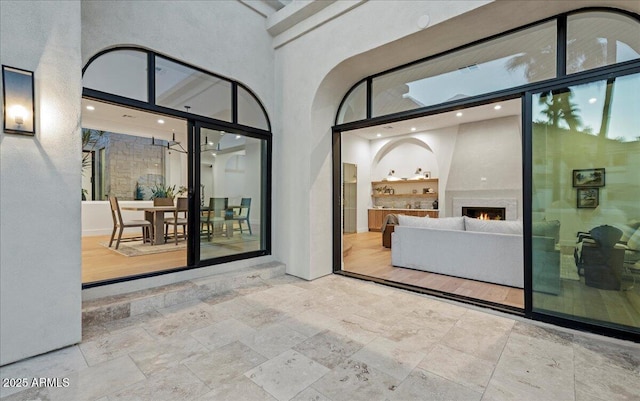 property entrance featuring a patio area