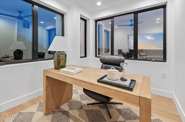 home office with visible vents, baseboards, recessed lighting, and wood finished floors