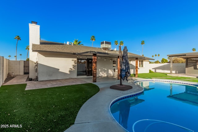 view of pool featuring a fenced in pool, a yard, a fenced backyard, and a patio area