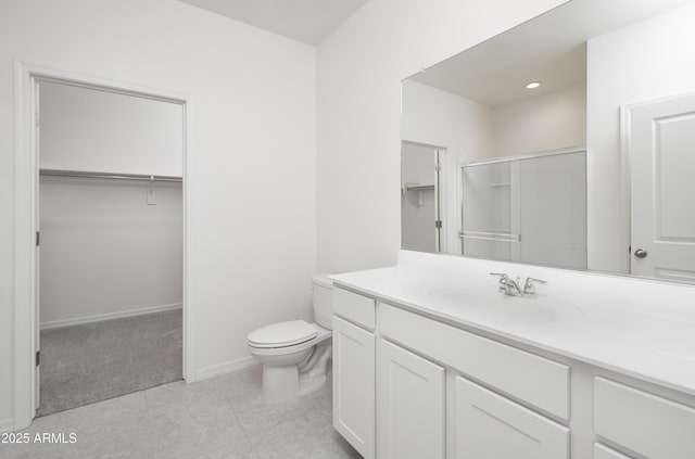 6064 E Artemis Dr, Florence, AZ 85132 - full bathroom featuring toilet, vanity, a spacious closet, baseboards, and recessed lighting