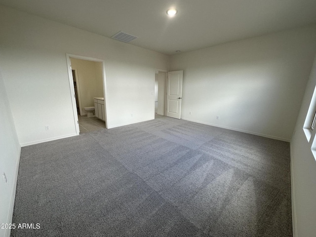 6064 E Artemis Dr, Florence, AZ 85132 - unfurnished bedroom with carpet flooring, baseboards, and ensuite bath
