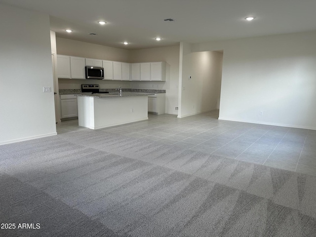 6064 E Artemis Dr, Florence, AZ 85132 - kitchen featuring appliances with stainless steel finishes, open floor plan, light tile patterned floors, baseboards, and recessed lighting