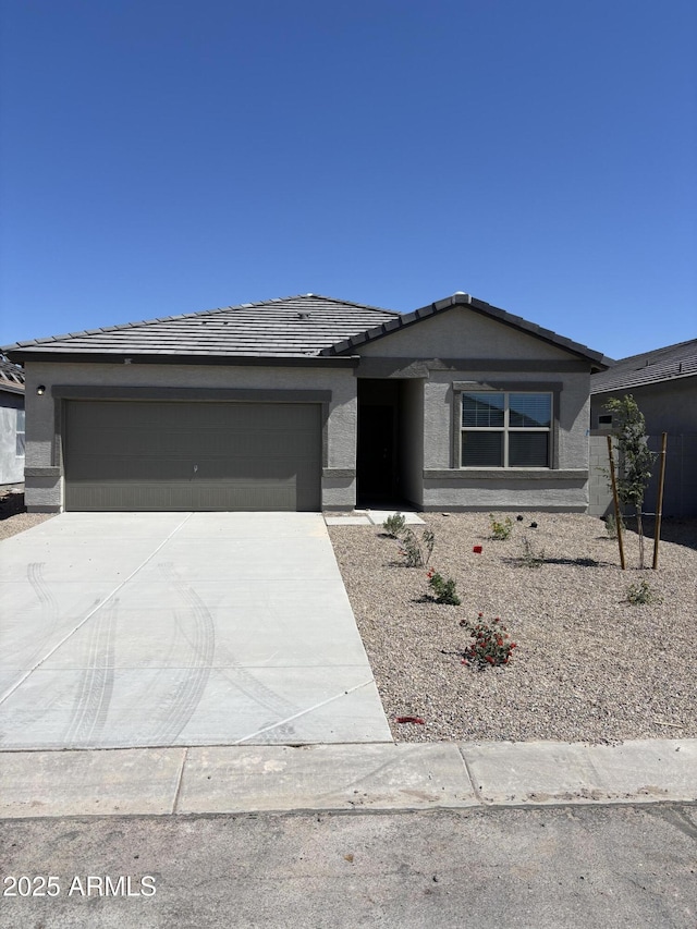 6064 E Artemis Dr, Florence, AZ 85132 - single story home with concrete driveway, a garage, a tile roof, and stucco siding