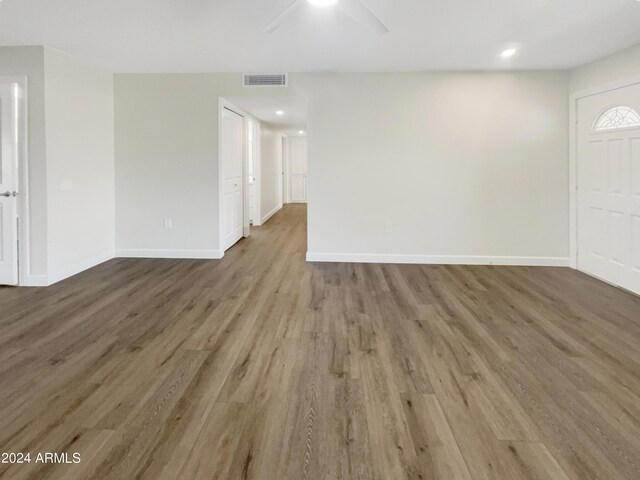 interior space with light hardwood / wood-style flooring and ceiling fan