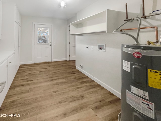 laundry area with washer hookup, electric water heater, light hardwood / wood-style flooring, and hookup for an electric dryer