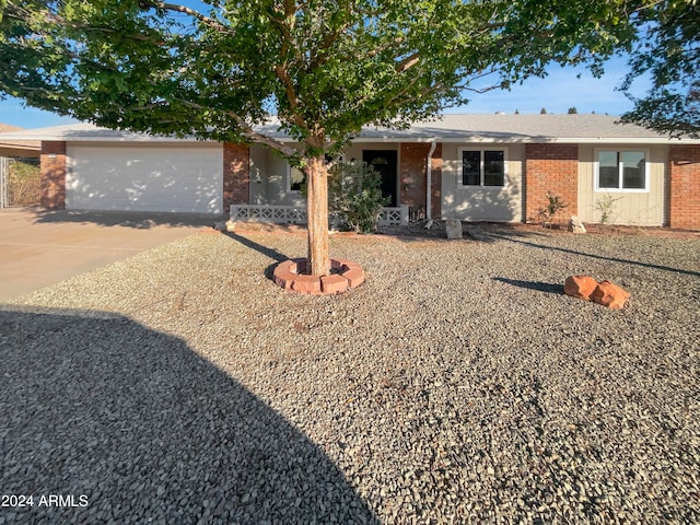 single story home featuring a garage