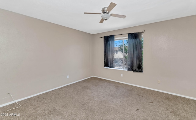 empty room with baseboards, a ceiling fan, and carpet