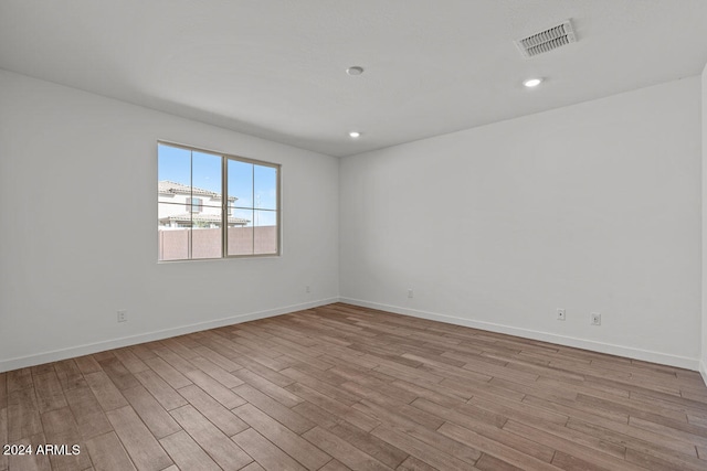 unfurnished room featuring light hardwood / wood-style floors