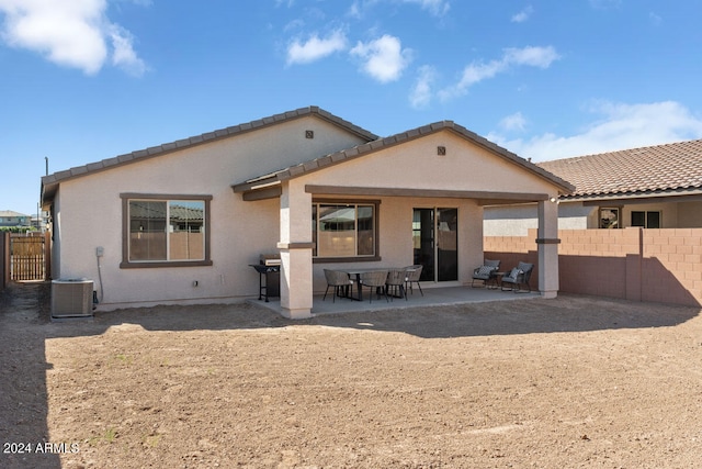 rear view of property featuring a patio area