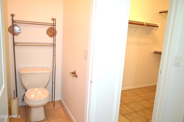 bathroom with tile patterned floors and toilet